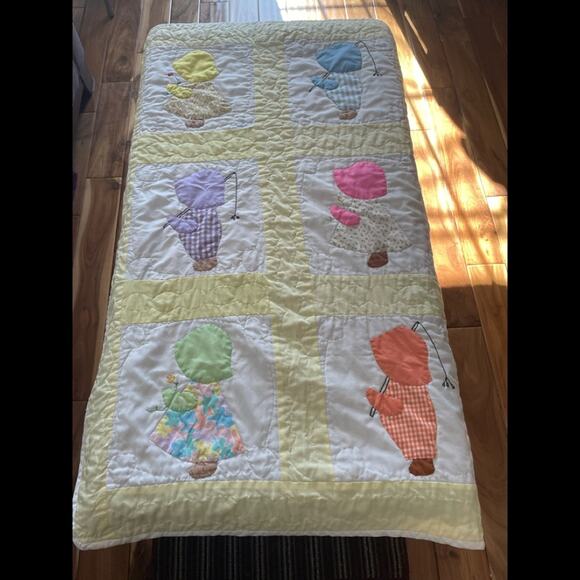 Handcrafted crib quilt.